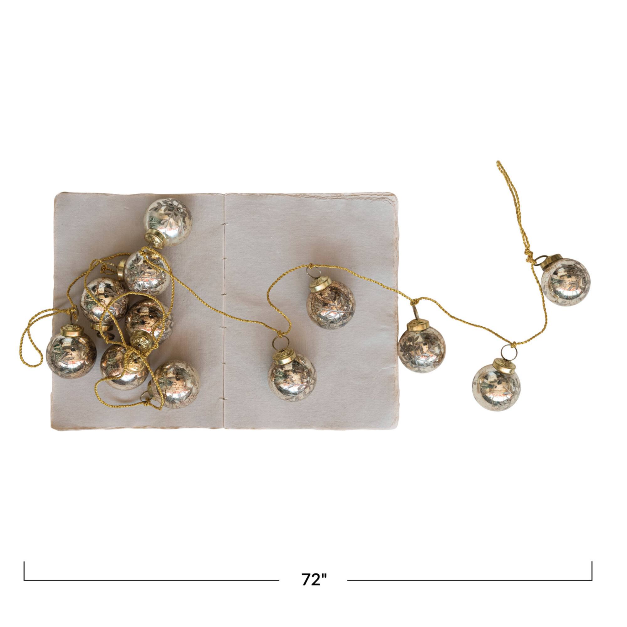 Hello Honey® 6ft. Antique Gold Etched Mercury Glass Ball Ornament Garland with Snowflakes